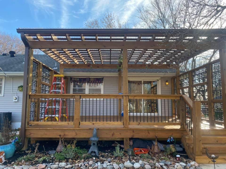 Finished cedar pergola with composite decking and outdoor living area
